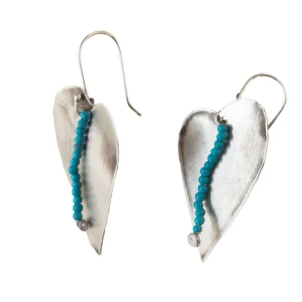 Handmade silver heart-shaped earrings, adorned with light blue beads.