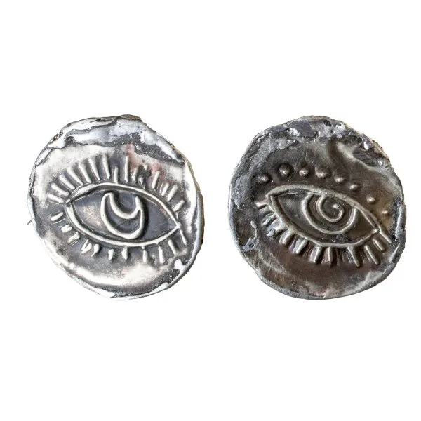 Handmade earrings made of argentium, featuring embossed eyes in various shapes.